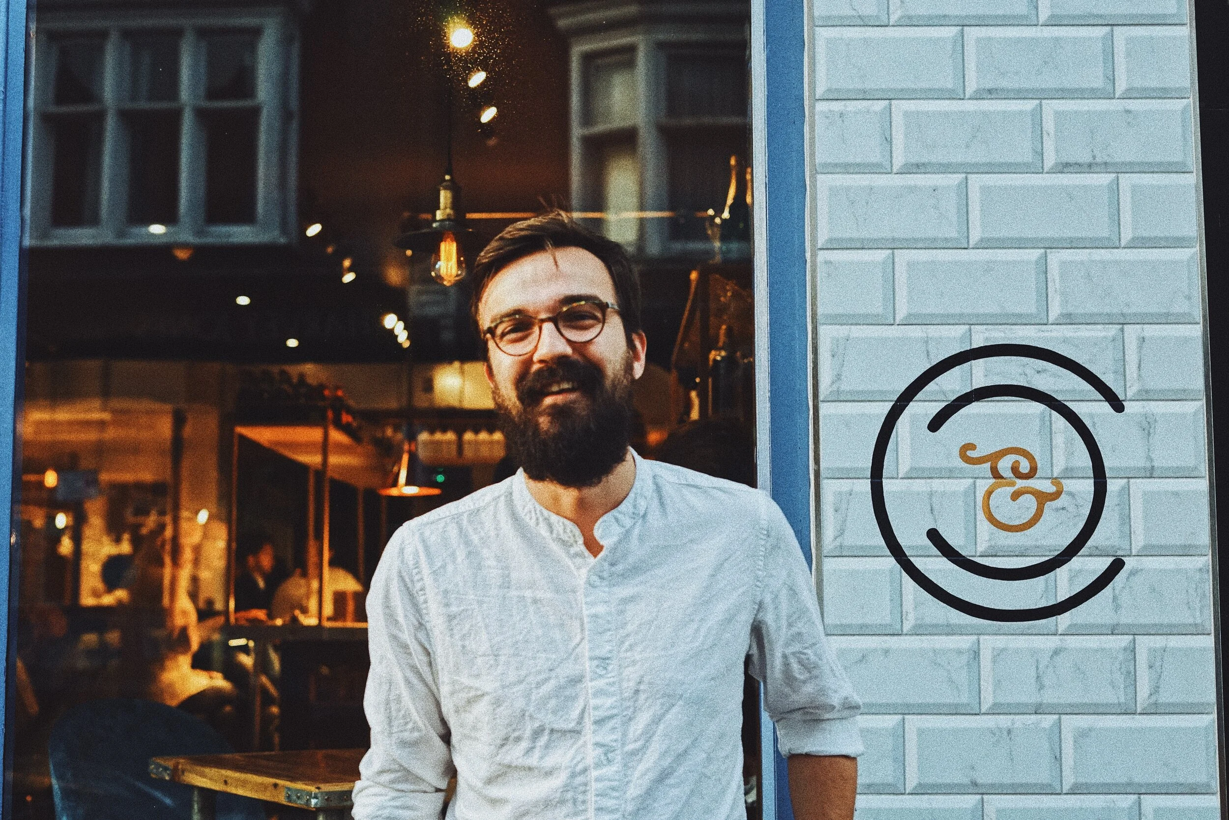 Marcin outside Cockle & Clam (which he designed)